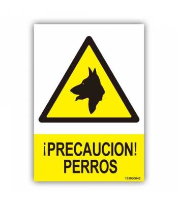 Advertencia, con pictograma y rótulo explicativos que avisa de perros guardando unas instalaciones