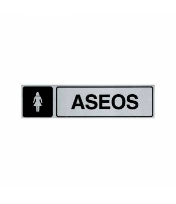 Señal informativa de aluminio en formato rectangular horizontal con texto y pictograma para ubicar la zona de aseos femeninos. Señal informativa de aluminio en formato rectangular horizontal con texto y pictograma para ubicar la zona de aseos femeninos.