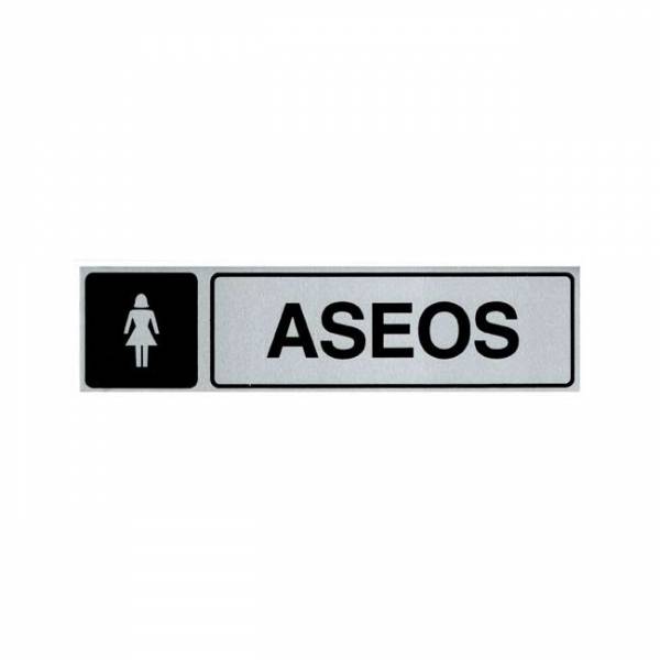 Señal informativa de aluminio en formato rectangular horizontal con texto y pictograma para ubicar la zona de aseos femeninos. Señal informativa de aluminio en formato rectangular horizontal con texto y pictograma para ubicar la zona de aseos femeninos.