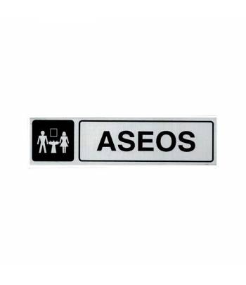 Señal informativa de aluminio en formato rectangular horizontal con texto y pictograma para señalizar la zona de aseos. Señal informativa de aluminio en formato rectangular horizontal con texto y pictograma para señalizar la zona de aseos.